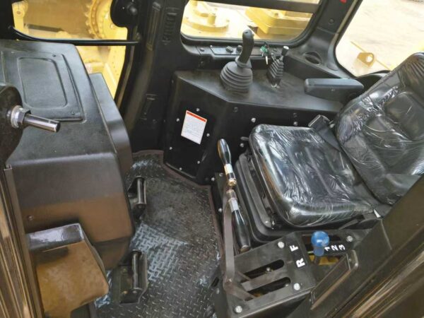 Inside HBXG SD7 bulldozer cab showing ergonomic controls