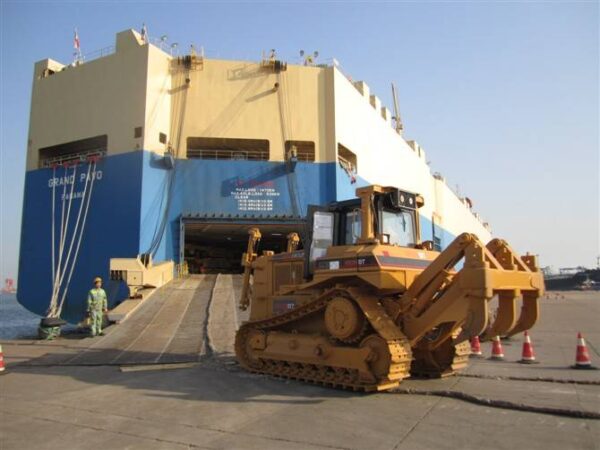 HBXG SD7 bulldozer being loaded onto cargo ship for export